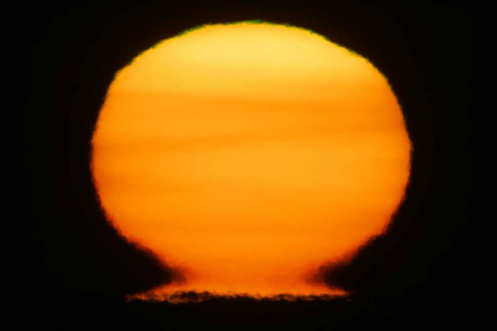 AK, Homer Sun at sunset distorted